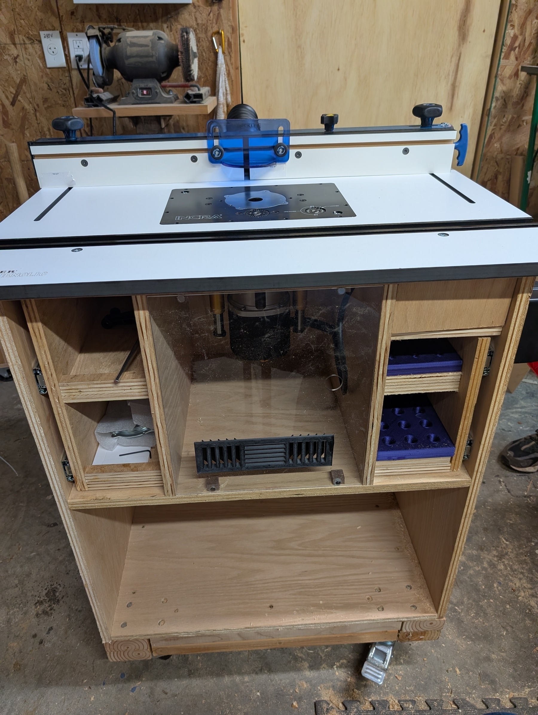 A homemade router table with purchased table top and fence.